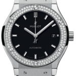 Hublot men's automatic watch with a black dial, diamond-studded bezel, stainless steel case, and black leather strap, displaying date at 3 o'clock