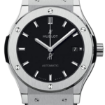 Hublot automatic wristwatch with black dial, silver bezel, and a black leather strap.