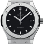 Hublot automatic watch with a black dial, silver hands, date at 3, and black leather strap.