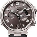 Breguet luxury wristwatch with grey dial, Roman numerals, three subdials, date window at 6, stainless steel case and black rubber strap.
