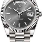 Rolex Day-Date wristwatch with grey dial, fluted bezel, and date window showing 28.