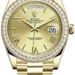 Gold Rolex Day-Date watch with diamond-bezel, gold bracelet, day display reading MONDAY, and date 28