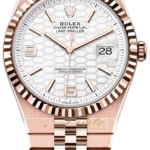 Rose gold Rolex Oyster Perpetual Land-Dweller wristwatch with a honeycomb white dial and date window at 3.