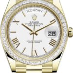 Gold Rolex Day-Date wristwatch with diamond bezel, white dial, Roman numerals, day at 12, date 28, and gold bracelet