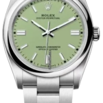 Stainless steel Rolex Oyster Perpetual wristwatch with a light green dial, silver hour markers, and a metal bracelet.