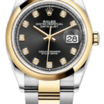 Two-tone Rolex Datejust wristwatch with diamond hour markers and black dial, gold bezel, and date window at 3 o'clock (cyclops lens)
