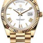 Gold Rolex Day-Date wristwatch with white dial, fluted bezel and gold bracelet, showing Monday and the date 28 in a magnified window