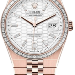 Rose gold Rolex Oyster Perpetual Land-Dweller with diamond bezel, white honeycomb dial, and date at 3 o'clock.