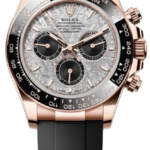 Rose gold Rolex chronograph watch with a black strap and black bezel, textured silver dial with three subdials.