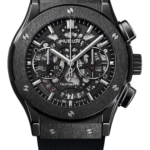 Skeleton watch with visible gears and black face, Hublot branding, automatic movement, and a black strap.