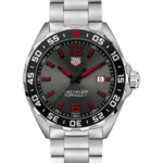 TAG Heuer Formula 1 stainless steel watch with black bezel, red hour markers, and date window at 3 o'clock