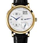 Gold A. Lange & Söhne wristwatch with white dial, blue hands, large date window, and black leather strap.