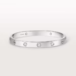 Cartier silver bracelet with evenly spaced round diamonds on a white background, polished and elegant.
