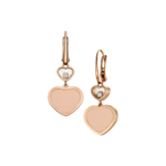 Rose-gold heart-shaped pendant with a crystal inset hanging from a chain, against a black background.