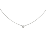 Delicate silver necklace with a small round diamond pendant on a black background.