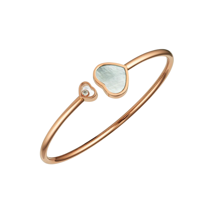 Rose gold bracelet with two heart-shaped ends, one small with a tiny stone and one larger with light-colored enamel centerpiece.